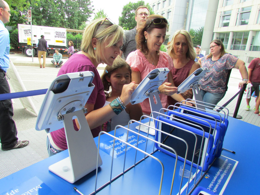 Visitors looking at Make Safe Happen info