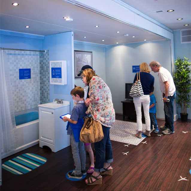 Families touring Make Safe Happen at Home experience