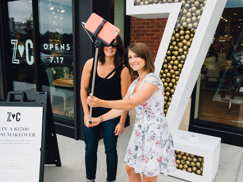Guests taking selfies at Z Gallerie event by Event Marketing Strategies