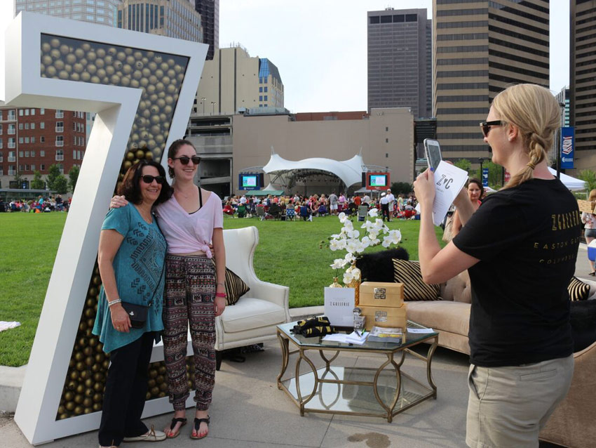 Guests pose with big Z at Z Gallerie event